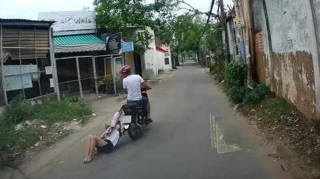 Tên cướp kéo lê cô gái hơn 500m trên đường phố Sài Gòn - Ảnh 2.