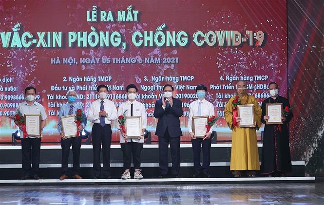 Thủ tướng Chính phủ Phạm Minh Chính dự Lễ ra mắt Quỹ vaccine phòng COVID-19 - Ảnh 9.