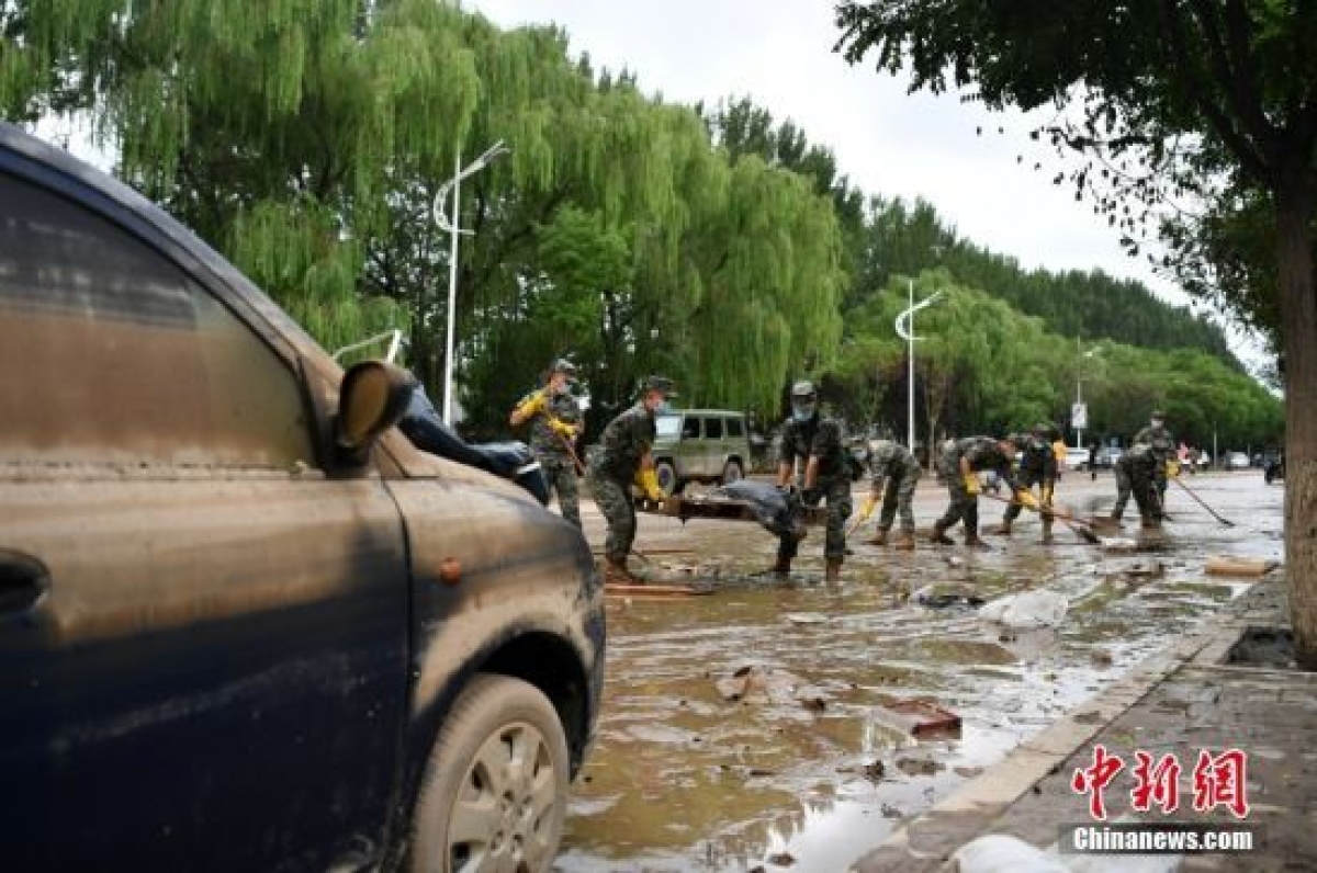 Trung Quốc liên tiếp phân bổ ngân sách cứu trợ các vùng bị lũ lụt nặng nề - Ảnh 1.