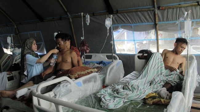 Nạn nhân vụ động đất ở Indonesia tăng lên 73 người - Ảnh 1.