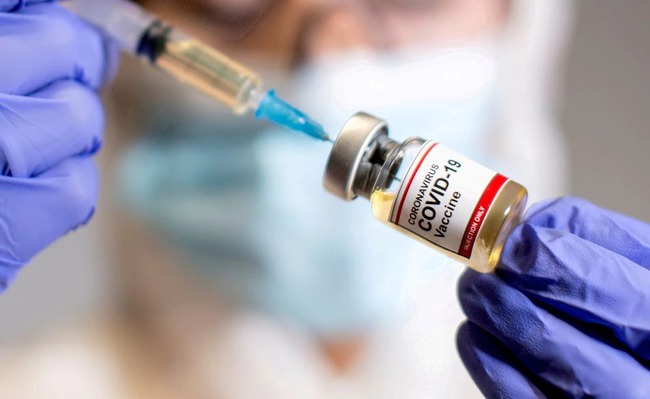 Khuyến cáo về hiện tượng sốt kéo dài sau khi tiêm vaccine Covid-19 - Ảnh 1.